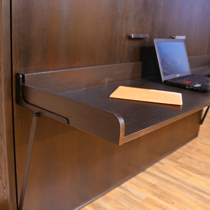 horizontal bed with murphy bed desk in guestroom